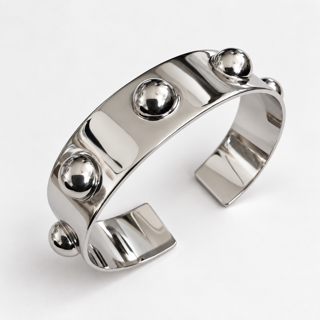 Roman Cuff bracelet close up in Silver Rhodium plated, on a pale clean background. 