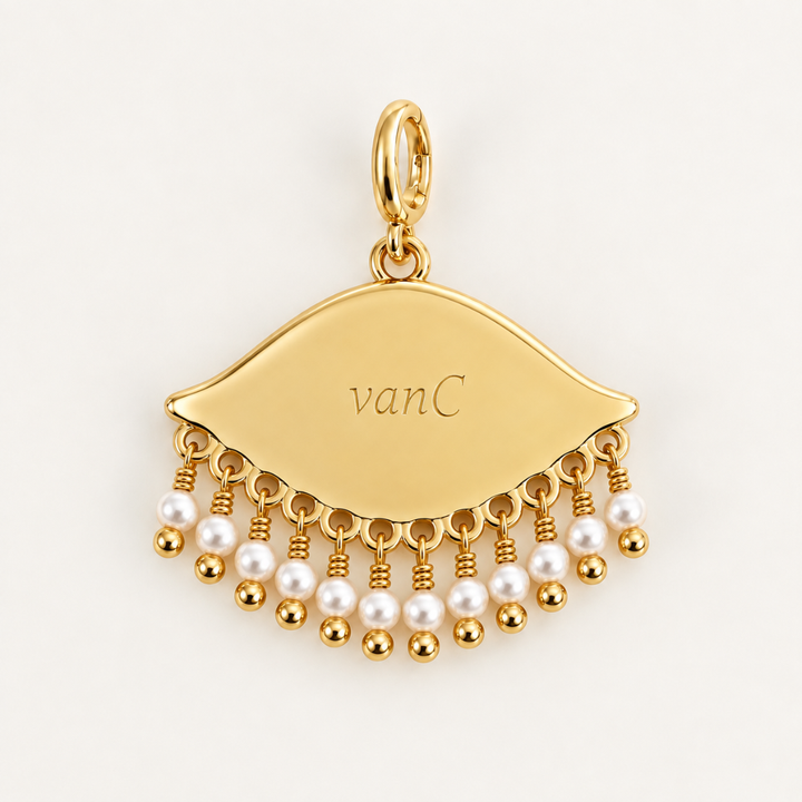 Back of the See the World 18K gold-plated eye charm with white pearl bead detailing, opening oval clasp and engraved Blauw van C branding.
