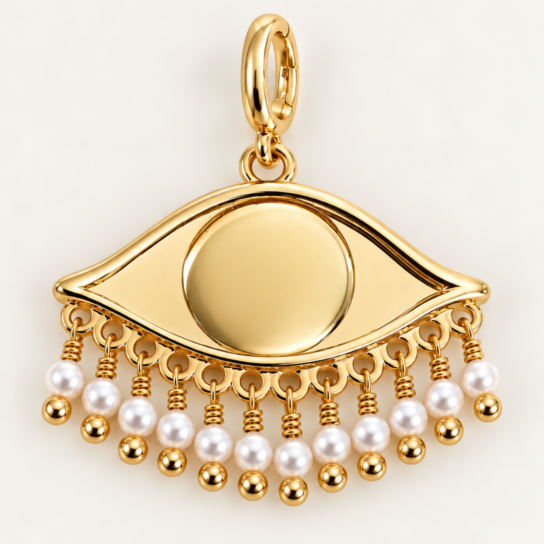 See the World 18K gold-plated eye charm with white pearl bead detailing and opening oval clasp by Blauw van C.