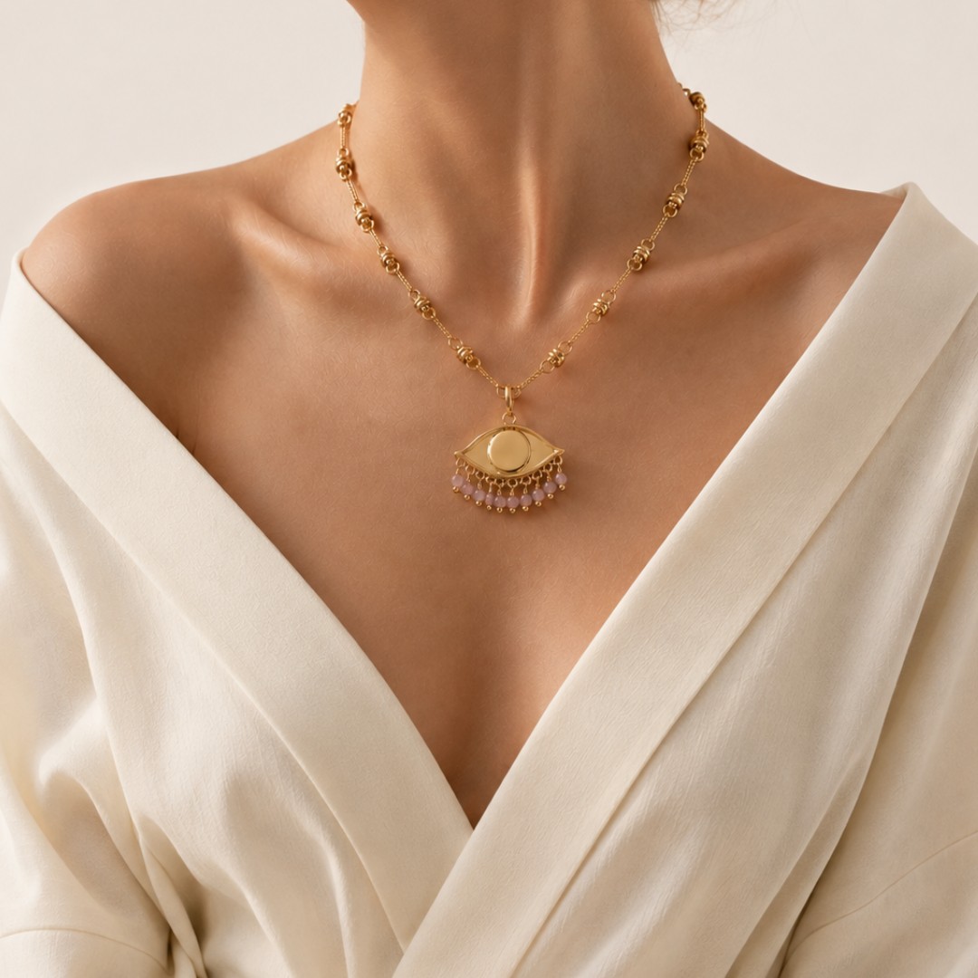 See the World Charm in Sakura Pink worn with a chunky bohemian chain and an off white kimono shirt.