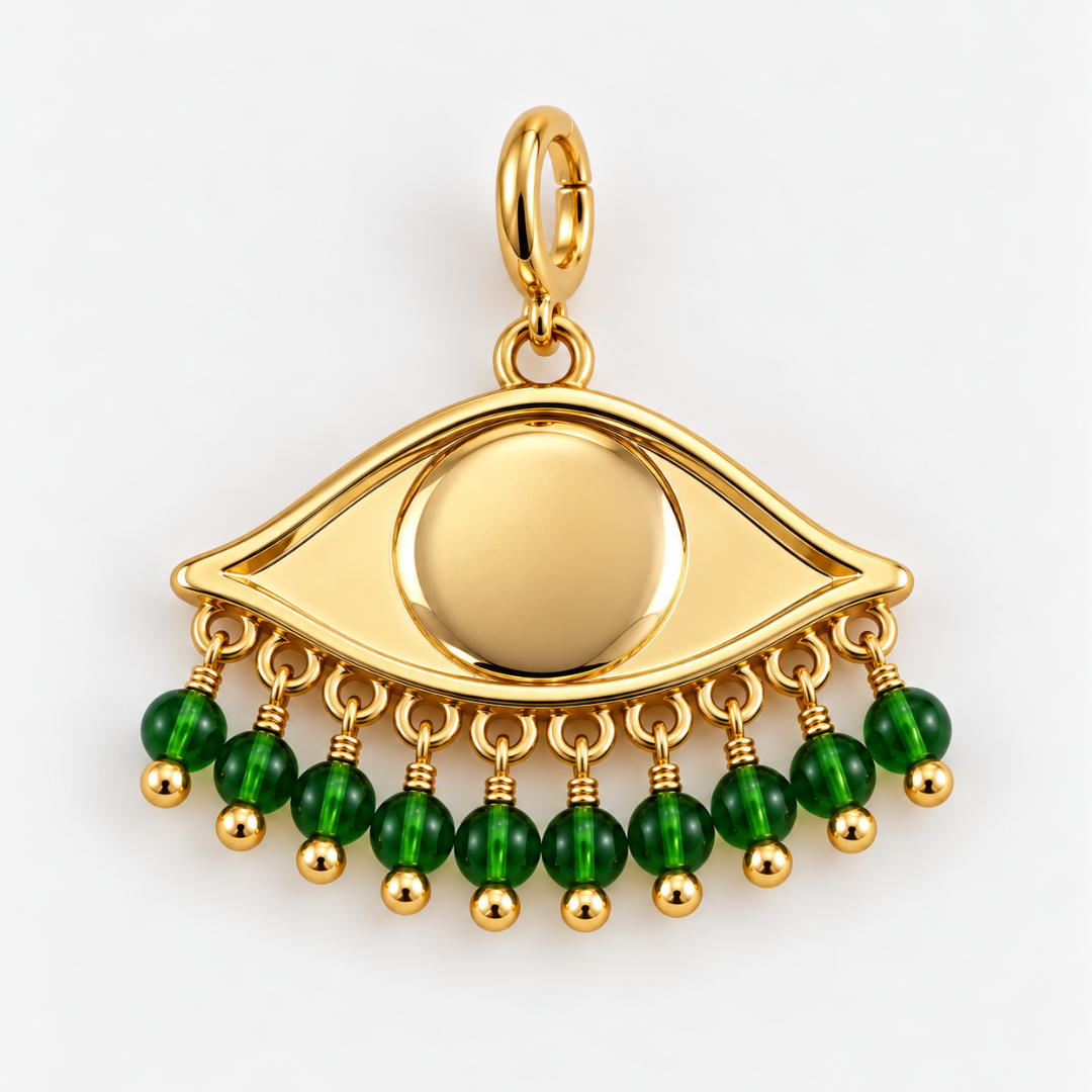 Gold plated See the world eye pendant charm with dangling green faceted beads on a clean white background.