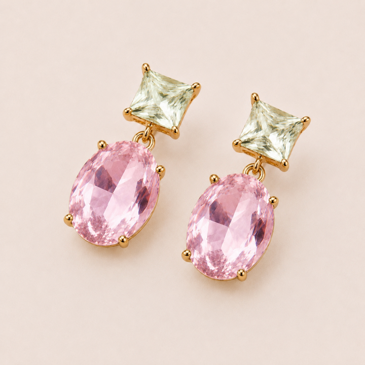 Pink and light green Two-Way Glow Crystal Earrings in 18k gold plating, photographed lay-flat on a neutral background.