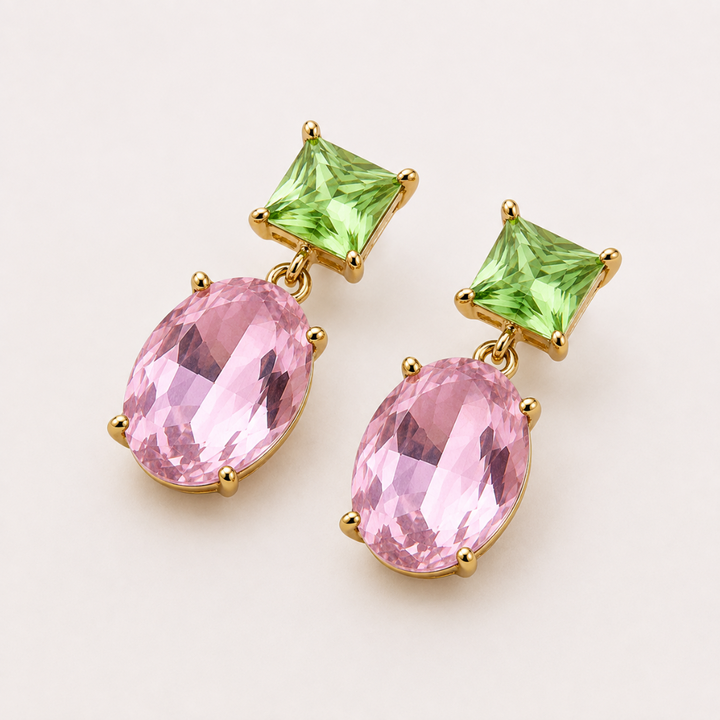 Two-Way Glow Crystal Earrings with pistachio green square-cut crystals and faceted pink oval drops in 18K gold plating, photographed in a lay-flat arrangement.