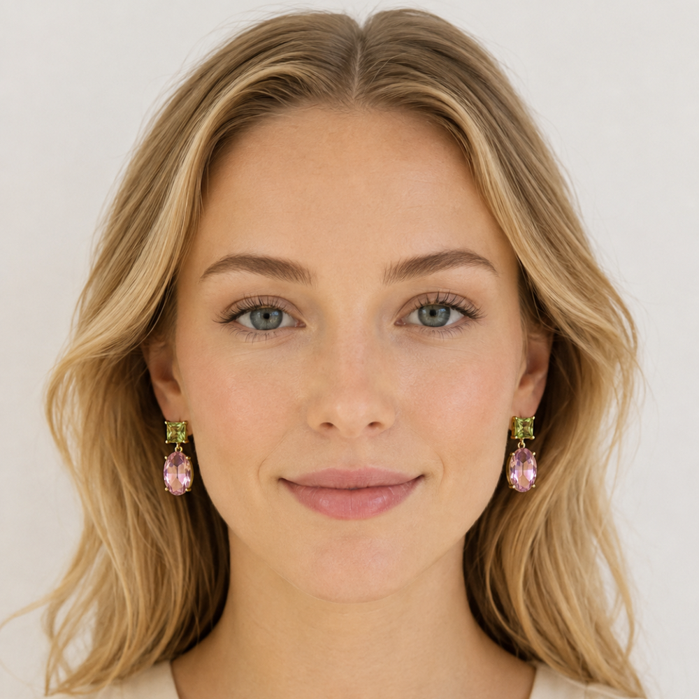 Blonde woman wearing Two-Way Glow Crystal Earrings with pistachio green square-cut crystals and faceted pink oval drops in 18K gold plating.