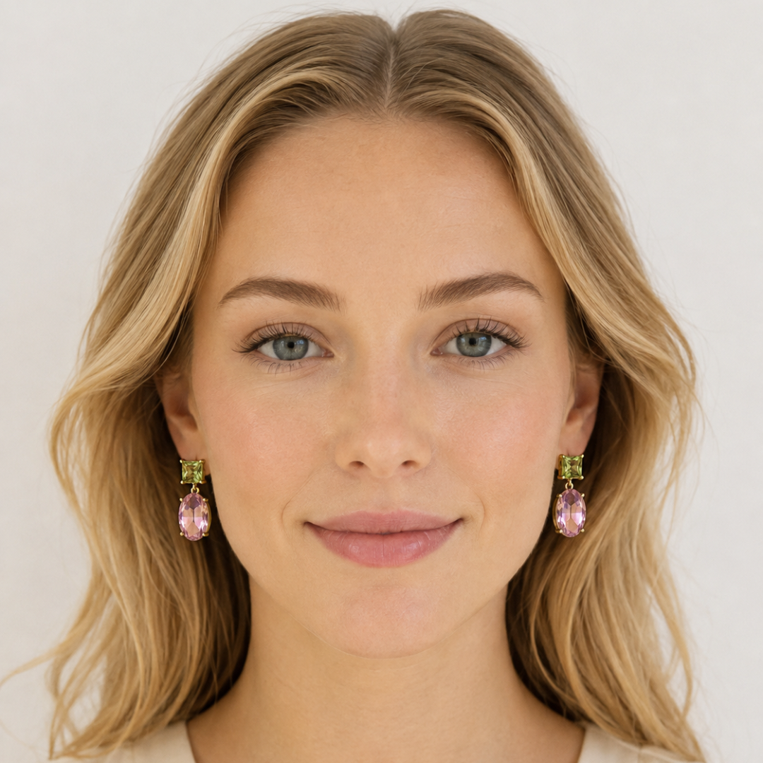 Blonde woman wearing Two-Way Glow Crystal Earrings with pistachio green square-cut crystals and faceted pink oval drops in 18K gold plating.